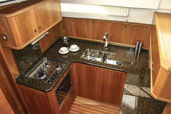yacht galley kitchen with lightweight stone countertops