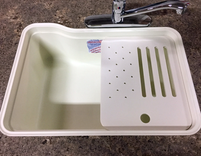 Under‑surface cutting board with right or left slots and drain holes – versatile kitchen accessory