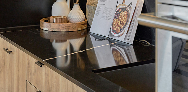 Kitchen with HanStone Markina quartz countertops featuring warm white veining
