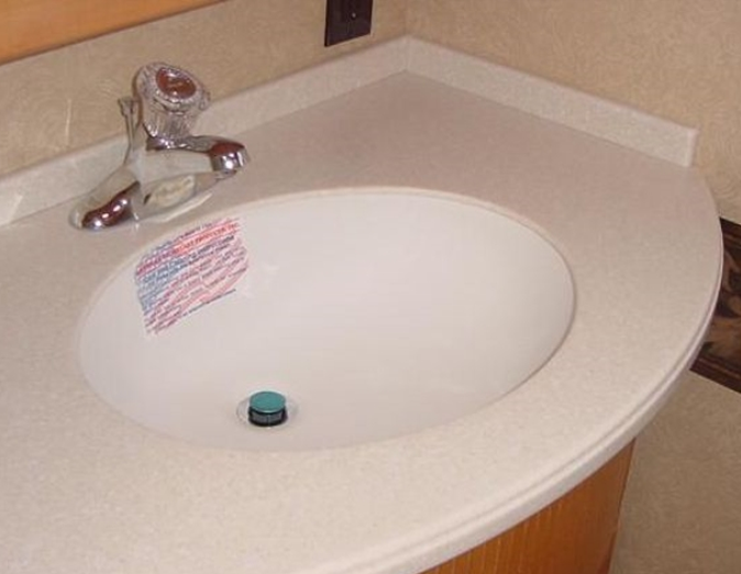 Solid surface RV bathroom sink for camper and travel trailer