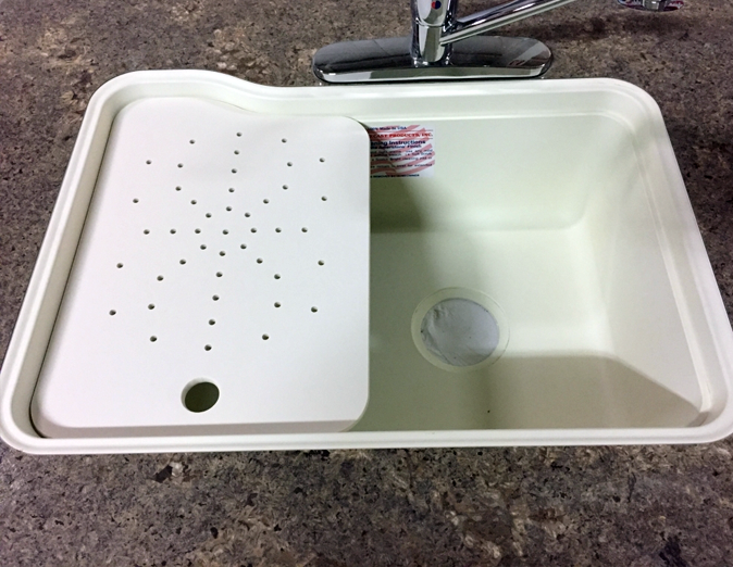 Under-surface cutting board with right or left drain holes – versatile kitchen accessory