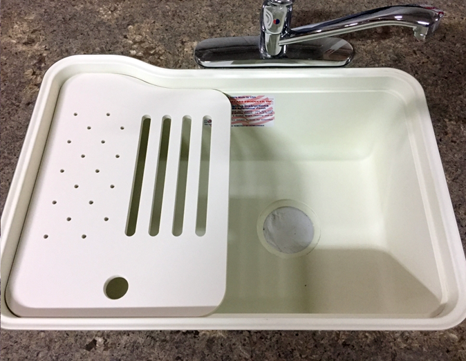 Under‑surface cutting board with right or left slots and drain holes – versatile kitchen accessory